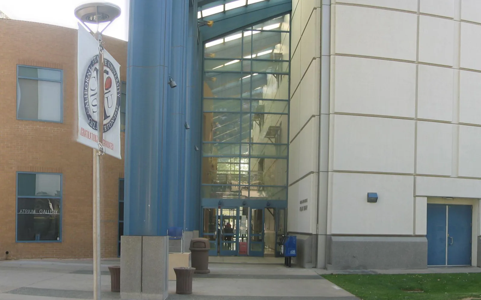 Pollack Library panorama on the Cal State Fullerton campus, showing the building and surrounding campus grounds